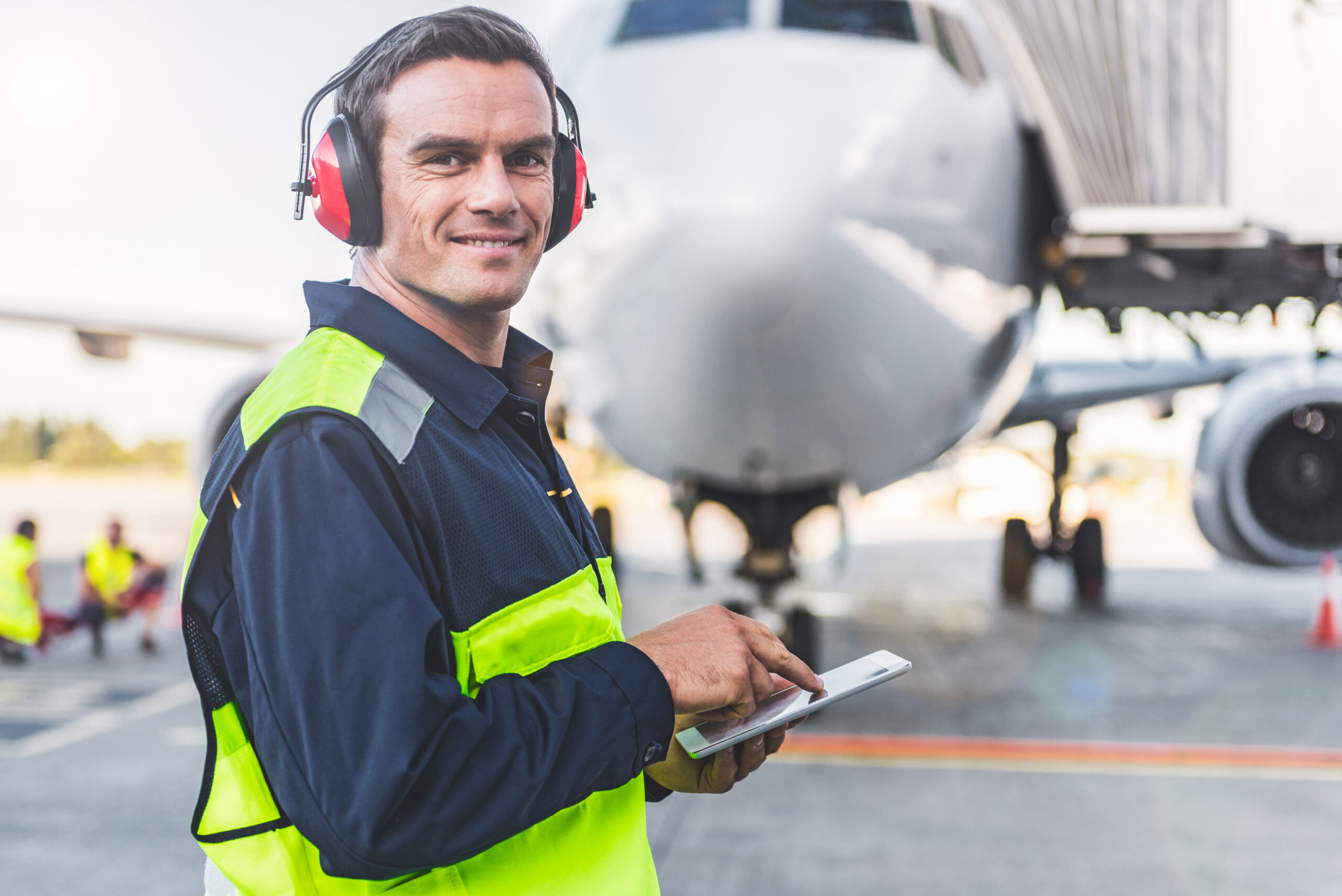 Happy mechanic having job in airdrome Airport services